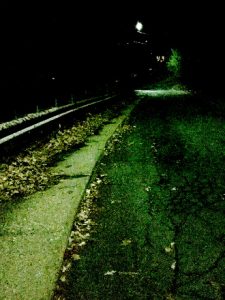 dimly lit road at night